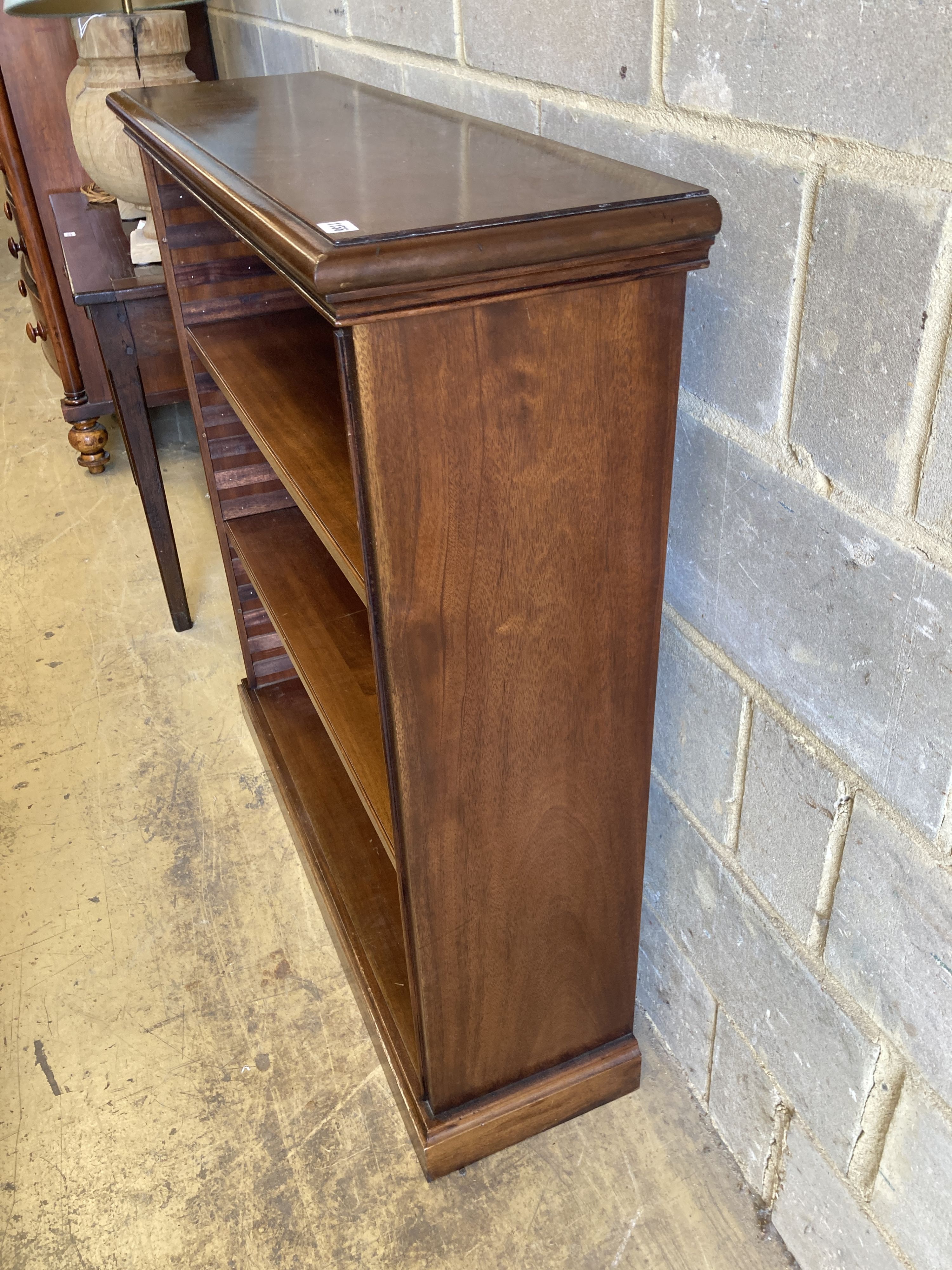 A Victorian style mahogany open bookcase, length 104cm, depth 31cm, height 112cm